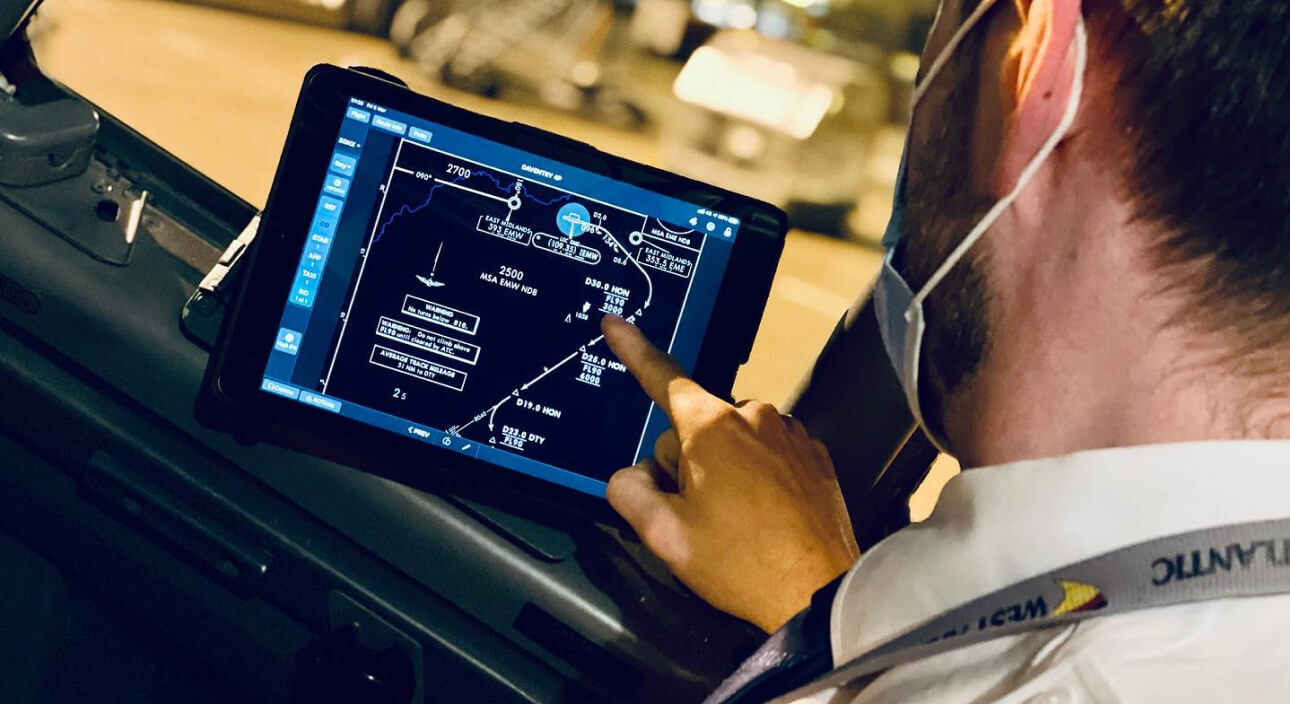 West Atlantic pilot in a cockpit, showcasing improved safety and communication through 5G connectivity.