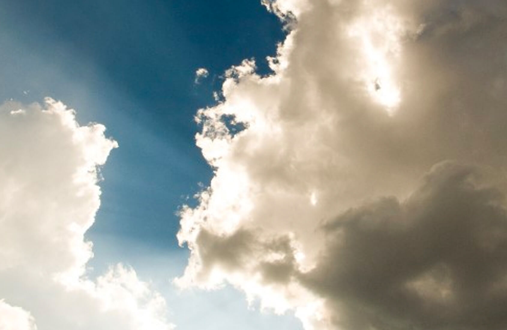 Clouds in the sky with sun beams